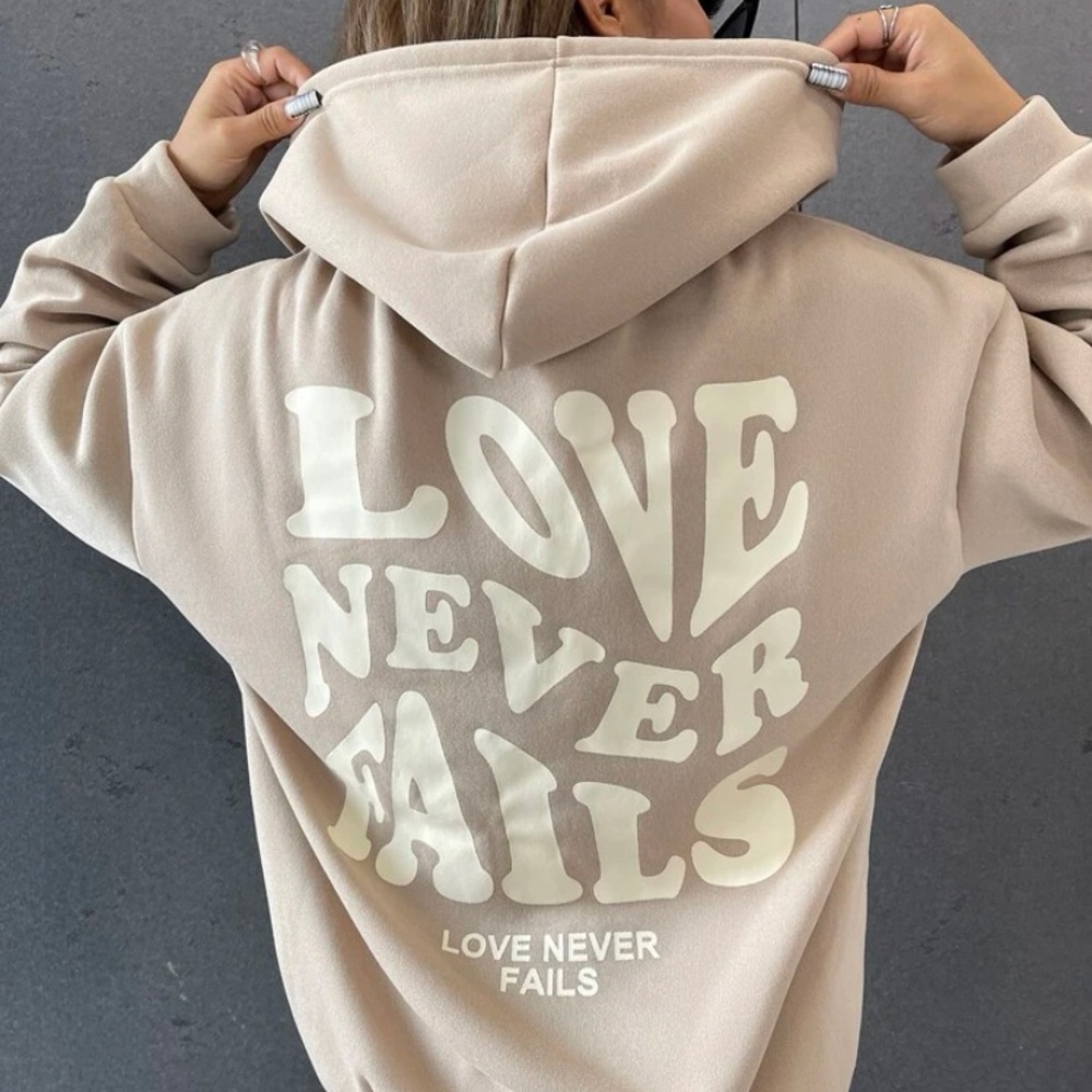 “love never fails” hoodie